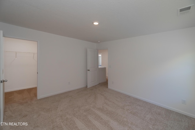 2740 Red Barn Rd, Knoxville, TN 37931 - unfurnished bedroom with visible vents, baseboards, a walk in closet, and carpet flooring