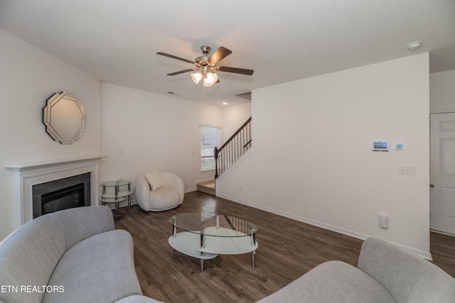 2740 Red Barn Rd, Knoxville, TN 37931 - living area with stairway, a ceiling fan, a glass covered fireplace, and wood finished floors