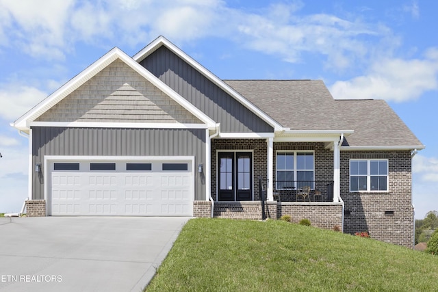 2718 Vista Meadows Ln, Sevierville, TN 37876 - craftsman house featuring concrete driveway, brick siding, a front lawn, and a garage
