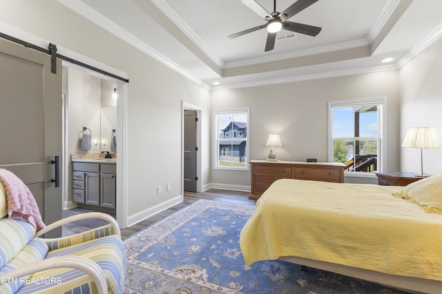 2718 Vista Meadows Ln, Sevierville, TN 37876 - bedroom featuring crown molding, wood finished floors, baseboards, a barn door, and a tray ceiling