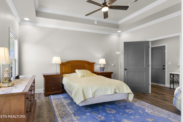2718 Vista Meadows Ln, Sevierville, TN 37876 - bedroom with baseboards, ornamental molding, a tray ceiling, and dark wood finished floors