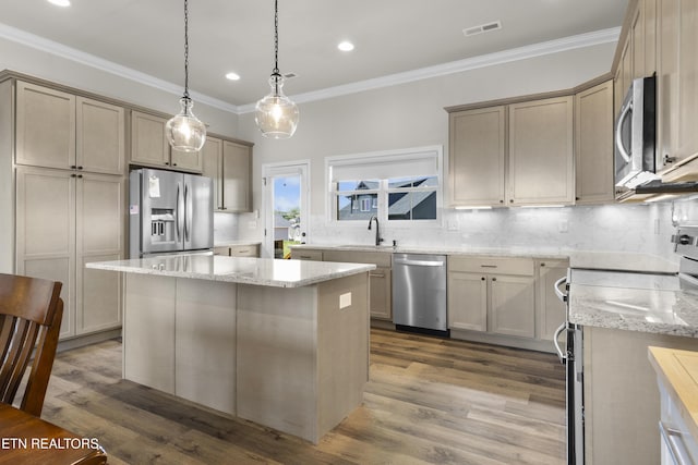 2718 Vista Meadows Ln, Sevierville, TN 37876 - kitchen with visible vents, crown molding, appliances with stainless steel finishes, tasteful backsplash, and light stone counters