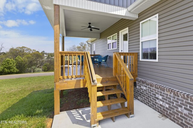2718 Vista Meadows Ln, Sevierville, TN 37876 - wooden deck with a lawn, a ceiling fan, and outdoor dining space