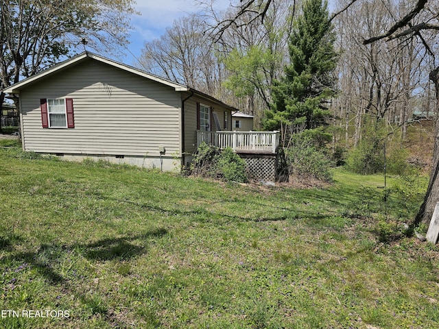 1009 Roysden Rd, Jamestown, TN 38556 - view of side of home with a deck, a lawn, and crawl space