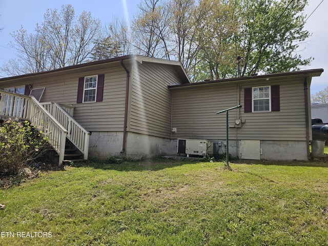 1009 Roysden Rd, Jamestown, TN 38556 - exterior space with stairs and a lawn