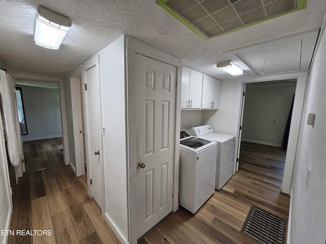 1009 Roysden Rd, Jamestown, TN 38556 - laundry area featuring cabinet space, visible vents, light wood-style flooring, and attic access
