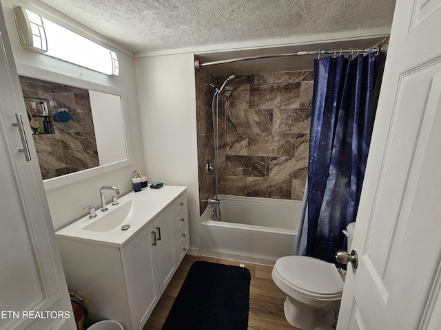 1009 Roysden Rd, Jamestown, TN 38556 - full bath with toilet, shower / tub combo with curtain, a textured ceiling, vanity, and wood finished floors