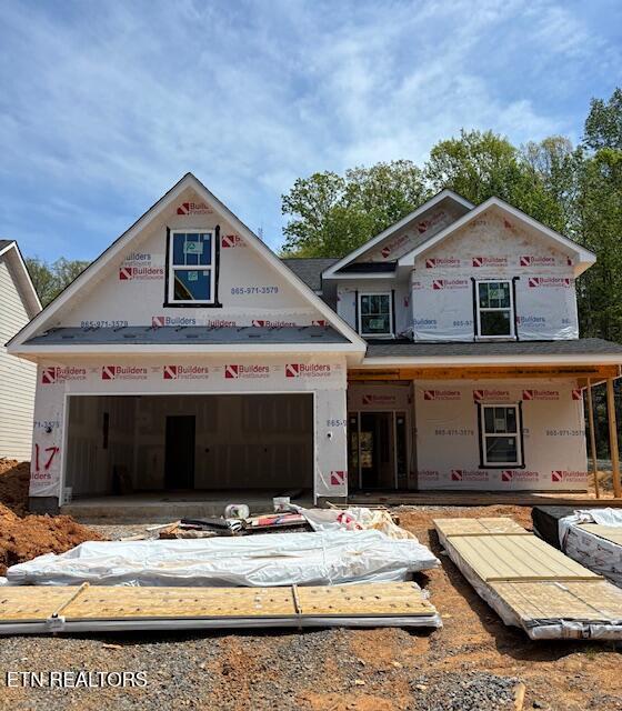 property in mid-construction with an attached garage
