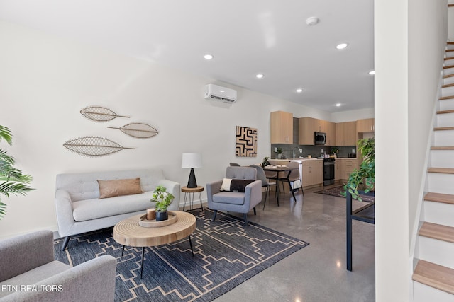 105 E Oldham Ave Unit 103, Knoxville, TN 37917 - living area with finished concrete floors, stairway, a wall mounted air conditioner, and recessed lighting