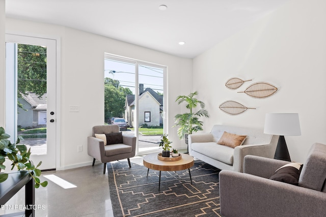 105 E Oldham Ave Unit 103, Knoxville, TN 37917 - living room featuring concrete flooring, plenty of natural light, baseboards, and recessed lighting