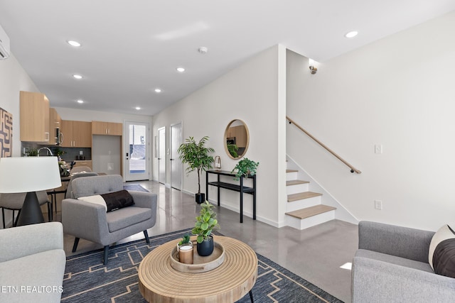 105 E Oldham Ave Unit 103, Knoxville, TN 37917 - living room with concrete flooring, baseboards, recessed lighting, stairway, and an AC wall unit