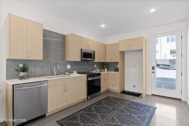105 E Oldham Ave Unit 103, Knoxville, TN 37917 - kitchen with stainless steel appliances, light brown cabinetry, a sink, and light countertops