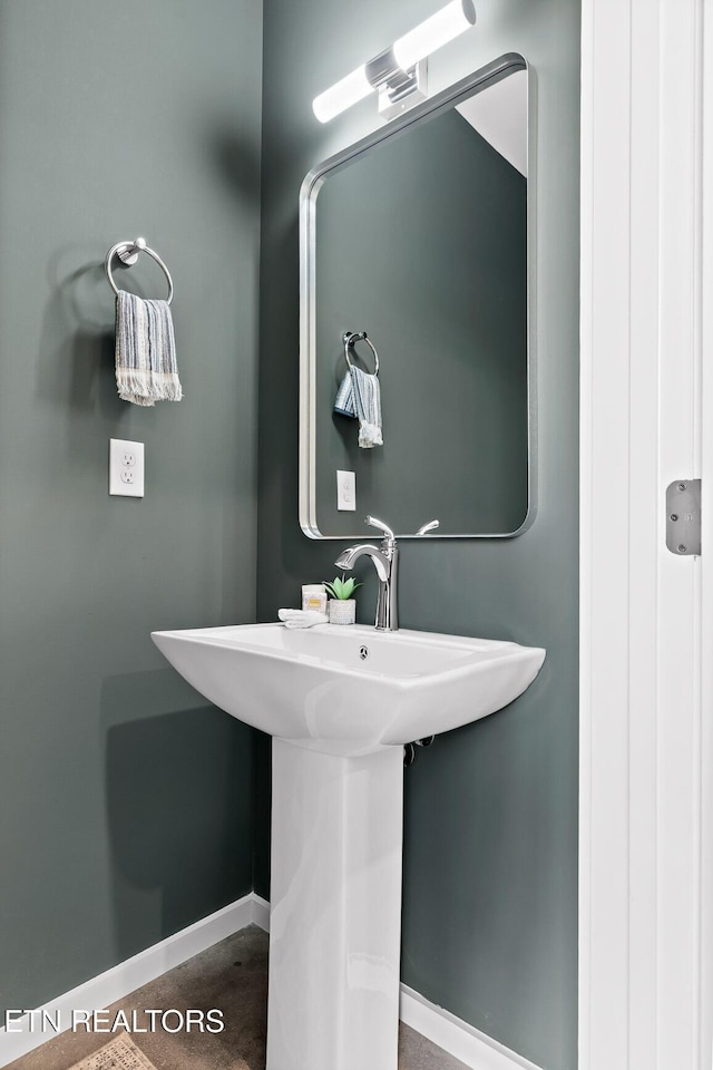 105 E Oldham Ave Unit 103, Knoxville, TN 37917 - bathroom featuring baseboards and a sink