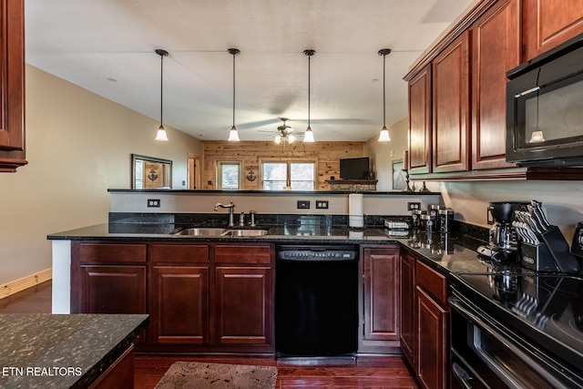 kitchen with ceiling fan, dark wood-style flooring, decorative light fixtures, a sink, and black appliances