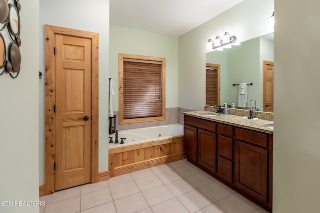 full bathroom featuring vanity, tile patterned flooring, and a jetted tub