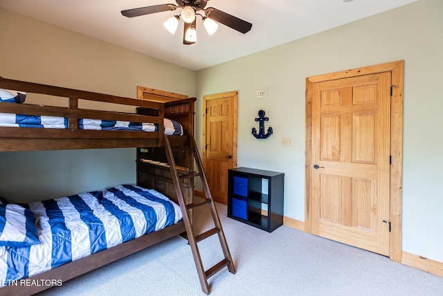 bedroom featuring carpet floors, a ceiling fan, and baseboards