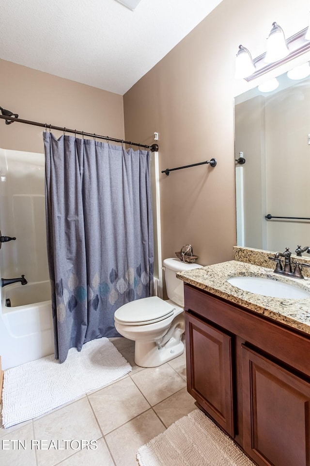 full bath with toilet, tile patterned floors, shower / tub combo with curtain, and vanity