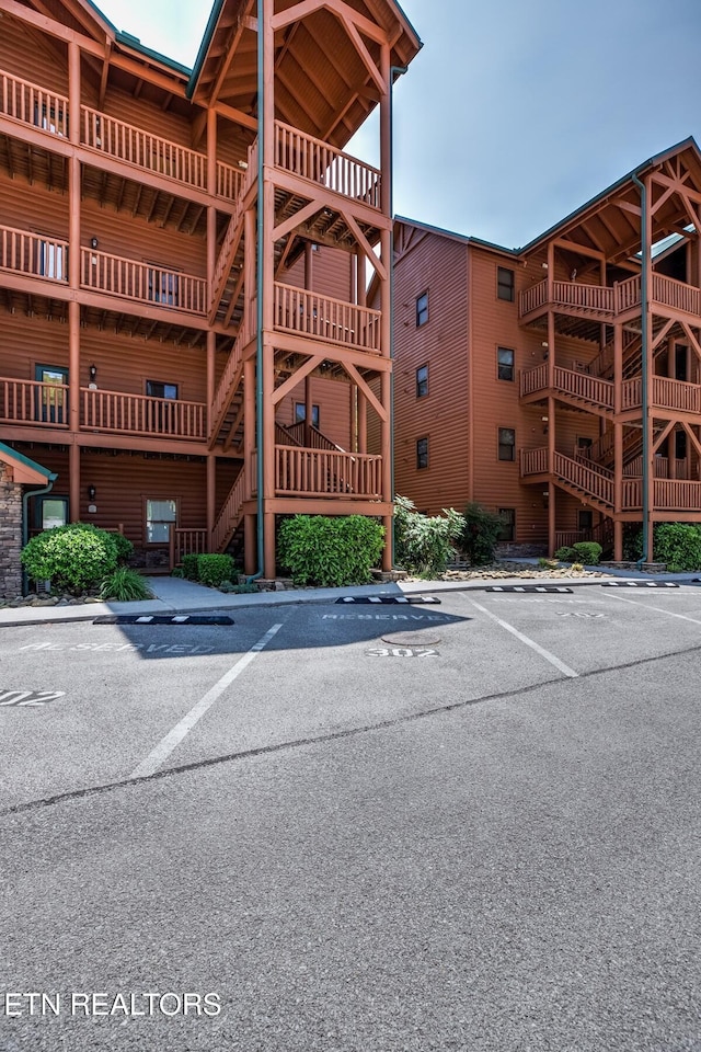 view of property featuring uncovered parking