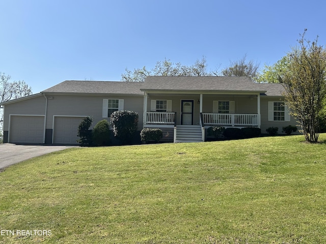 6332 Mountain Laurel Rd, Knoxville, TN 37924 - ranch-style house with covered porch, driveway, an attached garage, and a front yard