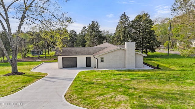 5911 Roberts Rd, Corryton, TN 37721 - exterior space featuring an attached garage, a front lawn, a chimney, and aphalt driveway