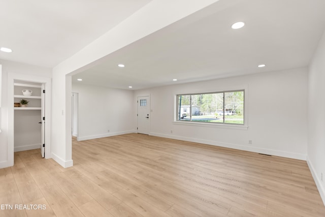 5911 Roberts Rd, Corryton, TN 37721 - unfurnished living room with light wood-style flooring, baseboards, and recessed lighting