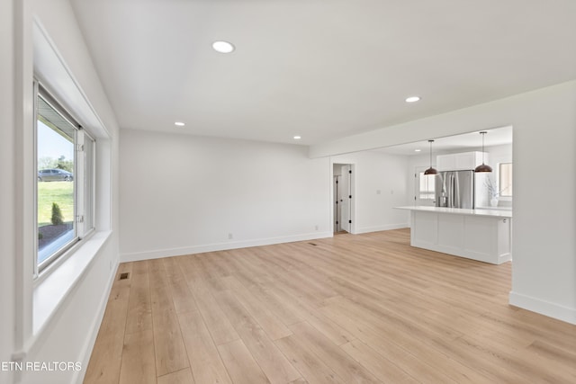 5911 Roberts Rd, Corryton, TN 37721 - unfurnished living room with light wood finished floors, baseboards, recessed lighting, and visible vents