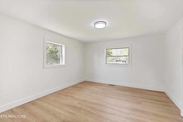 5911 Roberts Rd, Corryton, TN 37721 - spare room featuring light wood-type flooring, visible vents, and baseboards