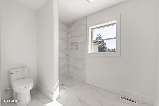 5911 Roberts Rd, Corryton, TN 37721 - bathroom with toilet, a marble finish shower, marble finish floor, baseboards, and visible vents