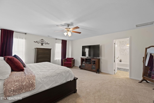 carpeted bedroom featuring visible vents, multiple windows, baseboards, and ceiling fan
