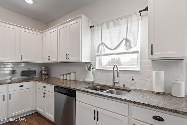 kitchen featuring stone countertops, backsplash, white cabinets, dishwasher, and a sink