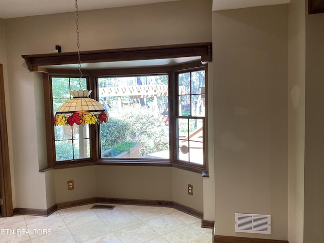 118 Mohawk Rd, Oak Ridge, TN 37830 - unfurnished dining area with visible vents, baseboards, plenty of natural light, and light tile patterned floors