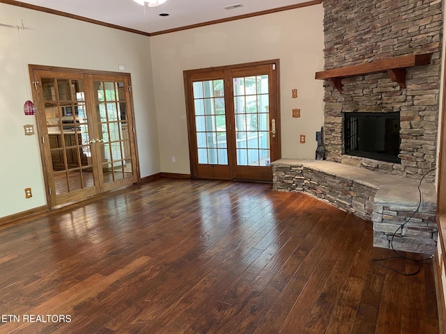 118 Mohawk Rd, Oak Ridge, TN 37830 - living room featuring baseboards, a stone fireplace, wood-type flooring, crown molding, and french doors