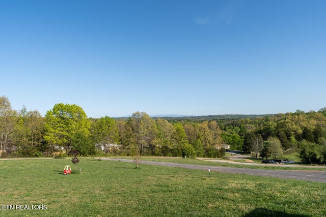 exterior space with a forest view
