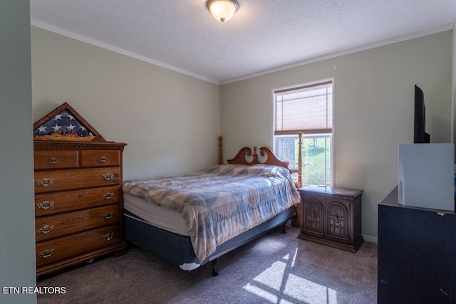 bedroom with baseboards, ornamental molding, and carpet floors