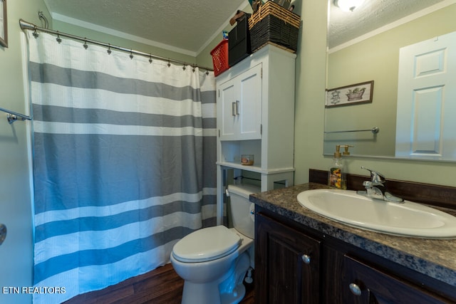 bathroom featuring toilet, a textured ceiling, and crown molding