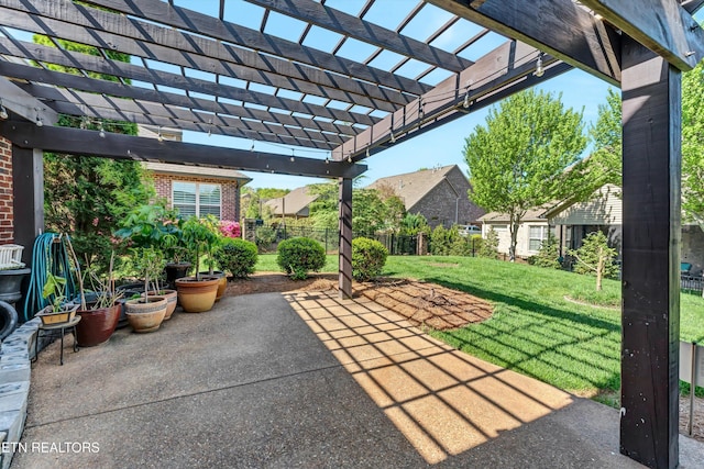 view of patio / terrace featuring a pergola and fence