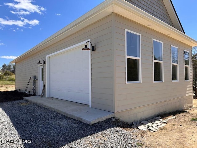 view of side of property featuring a garage