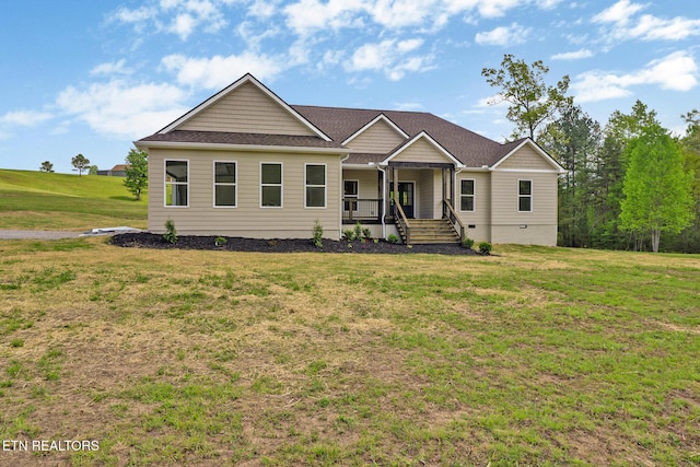 view of front facade featuring a porch, a front lawn, and crawl space