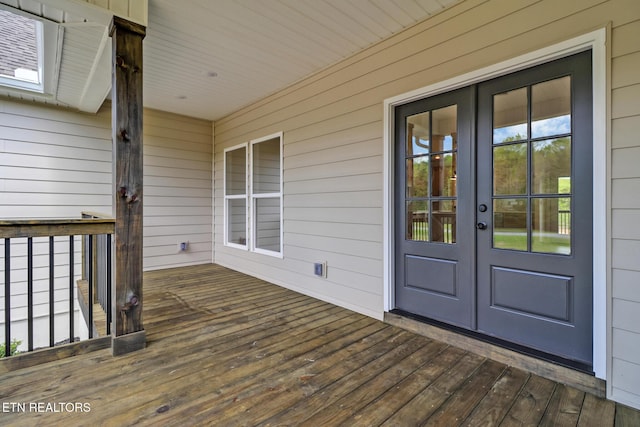 wooden deck featuring french doors