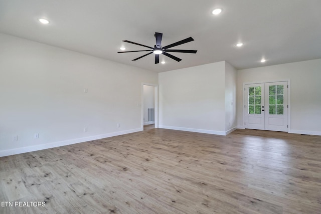 unfurnished living room featuring french doors, ceiling fan, baseboards, and wood finished floors