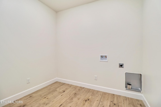 laundry room featuring laundry area, electric dryer hookup, light wood-type flooring, baseboards, and hookup for a washing machine