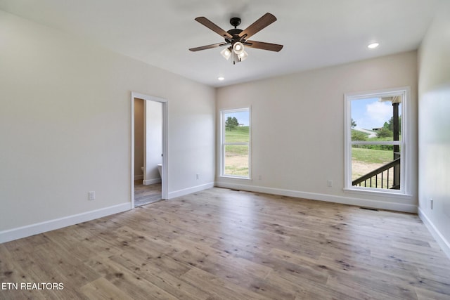 spare room with baseboards, ceiling fan, recessed lighting, and wood finished floors