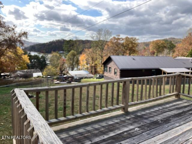wooden deck featuring a mountain view