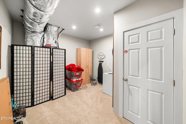 interior space featuring light carpet, visible vents, and recessed lighting