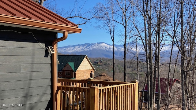 wooden terrace featuring a mountain view