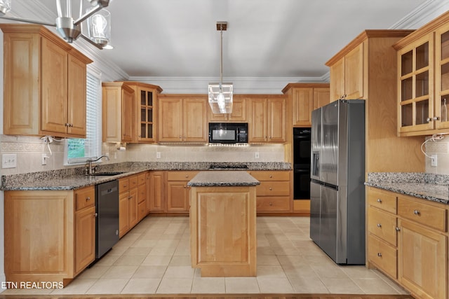 kitchen featuring backsplash, a sink, a kitchen island, crown molding, and black appliances