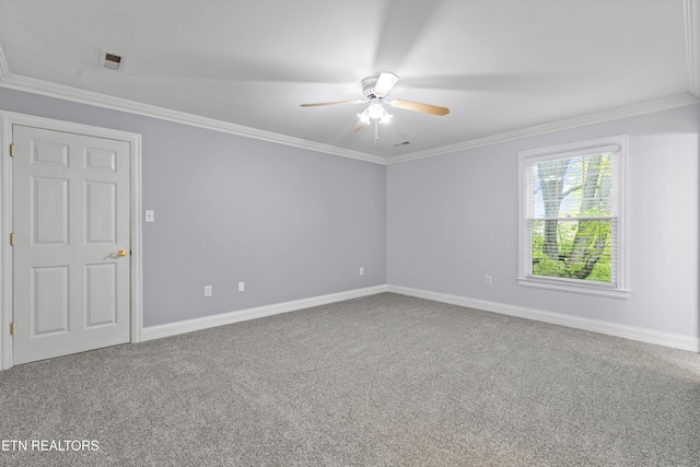 empty room featuring ceiling fan, baseboards, crown molding, and carpet