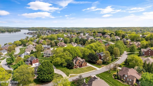 birds eye view of property with a residential view and a water view