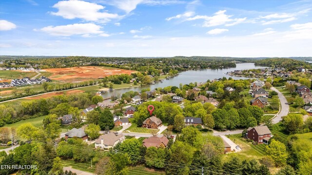 birds eye view of property with a residential view and a water view