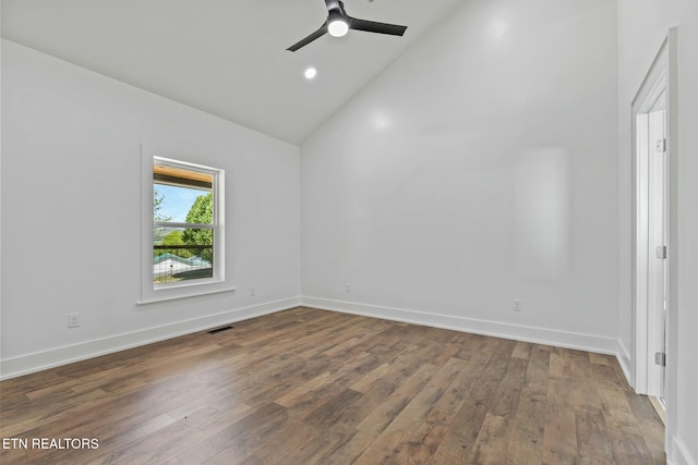 unfurnished room with wood-type flooring, visible vents, baseboards, ceiling fan, and high vaulted ceiling